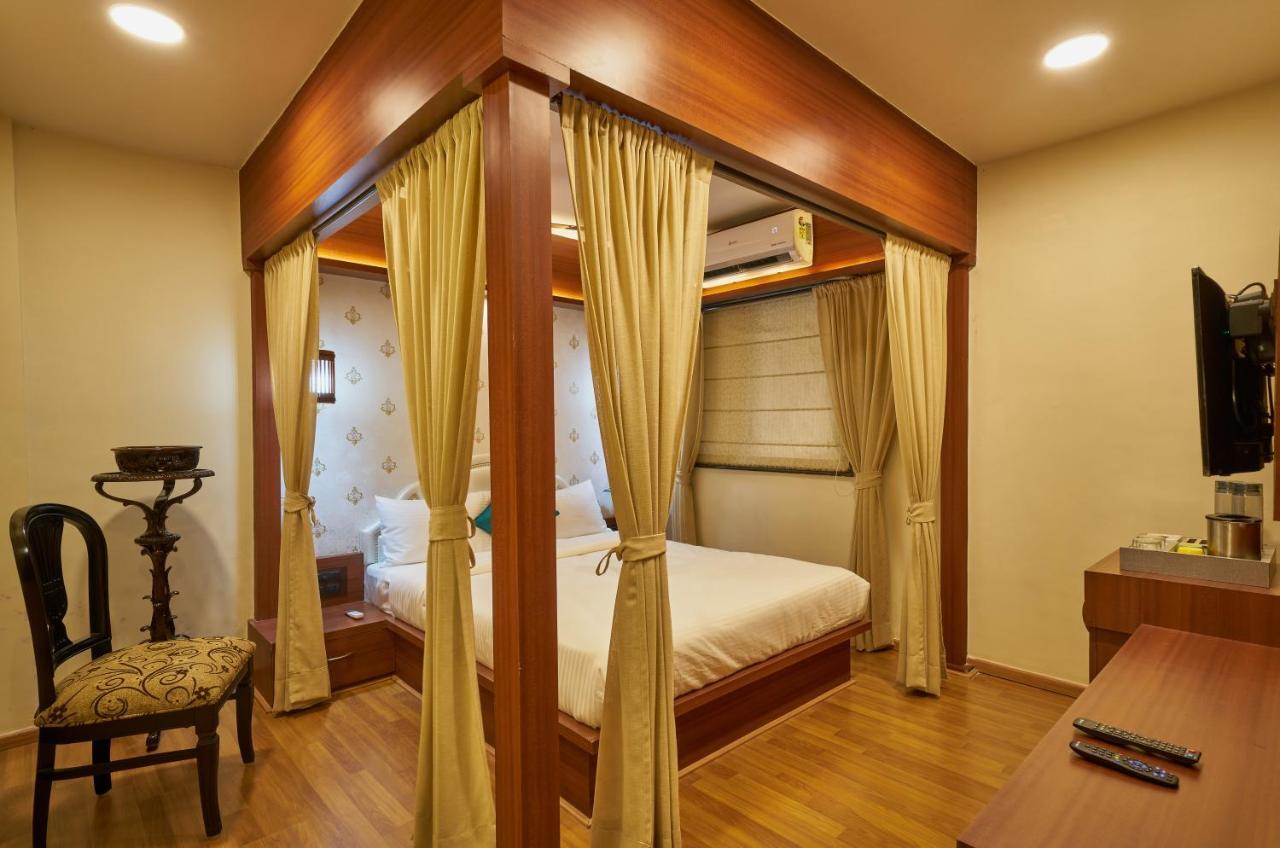 Tranquil La Casa Hotel Poona Kamer foto